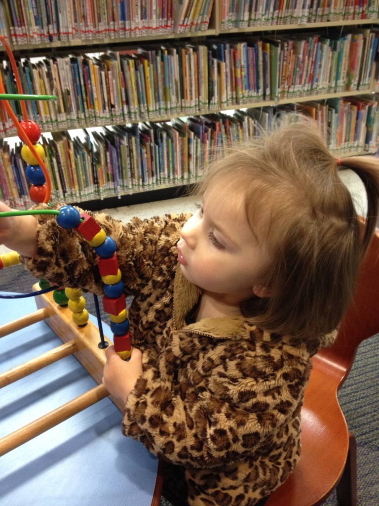 Playing with beads at the library